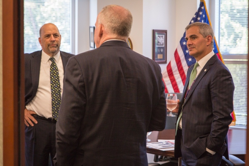 NCTC Director Matthew Olsen (center) shares a laugh with former NCTC directors Michael Leiter (left) and John Brennan (right) prior to the June 2014 NCTC directors panel. (ODNI Public Affairs)
