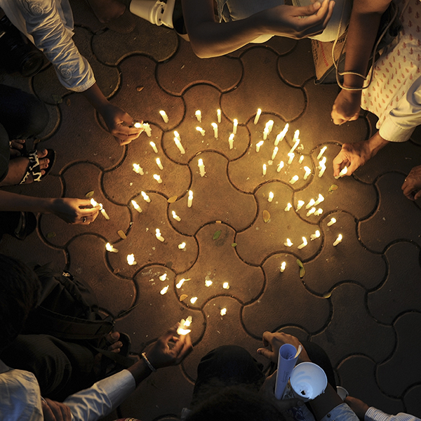 Indians light candles during a vigil on the eve of those killed during the November 26, 2008 militant attacks in Mumbai on November 25, 2010. India was set to mark the second anniversary of the militant attacks on Mumbai with memorial events and prayer meetings to honour the 166 victims killed during 60 hours of terror. Police and security forces who tackled the ten Islamist gunmen were due to parade through the city, while mourners also planned to gather at the hotels, railway station, cafe and Jewish centre where the massacres took place. AFP PHOTO/Indranil MUKHERJEE